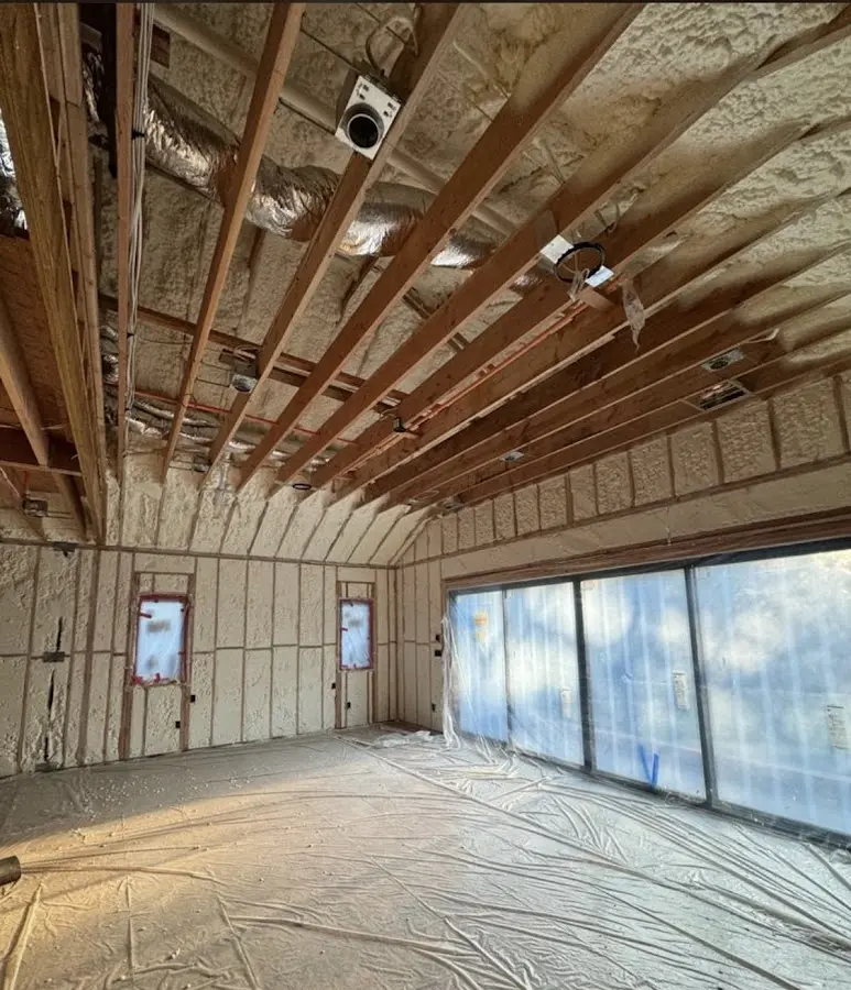 Interior walls and ceiling insulated with spray foam during new construction in Kinderhook